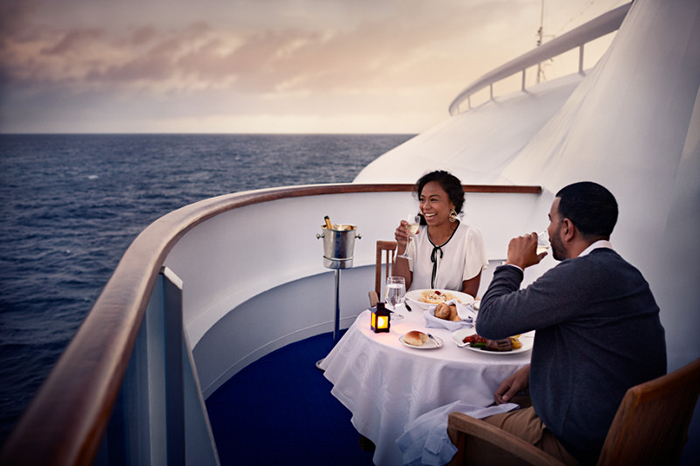 Balcony Dining couple having dinner on cruise