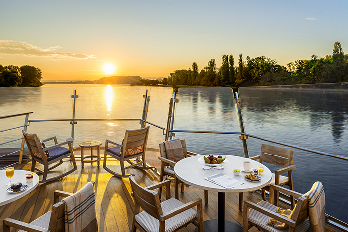 Aquavit Terrace at dawn with breakfast on the table onboard the Viking Longship Hlin in the Upper Middle Rhine Valley in Germany