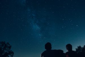 two people stargazing 