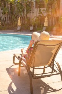 Breast cancer survivor Shannon Phillips lounging poolside at Grand Pacific Palisades during her gifted vacation